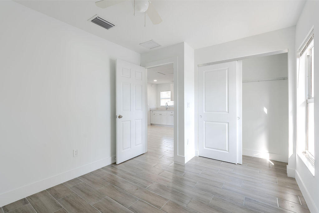 3246 Jefferson Street Stuart, FL 34997 - Photo 16 of 19 a view of an empty room and wooden floor