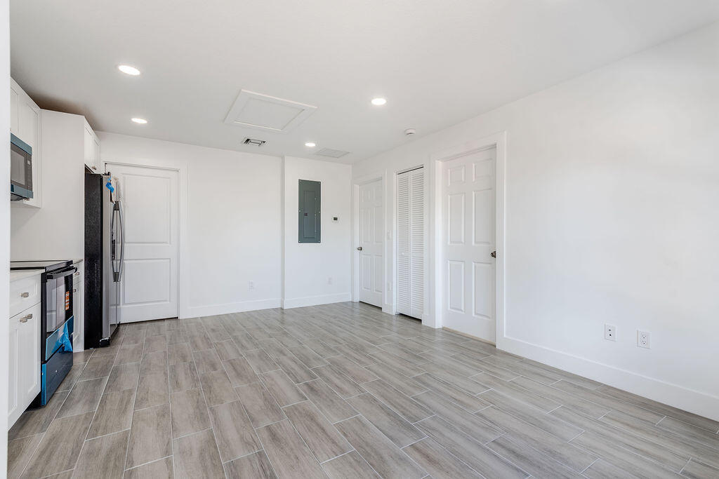 3246 Jefferson Street Stuart, FL 34997 - Photo 7 of 19 a view of an empty room with wooden floor