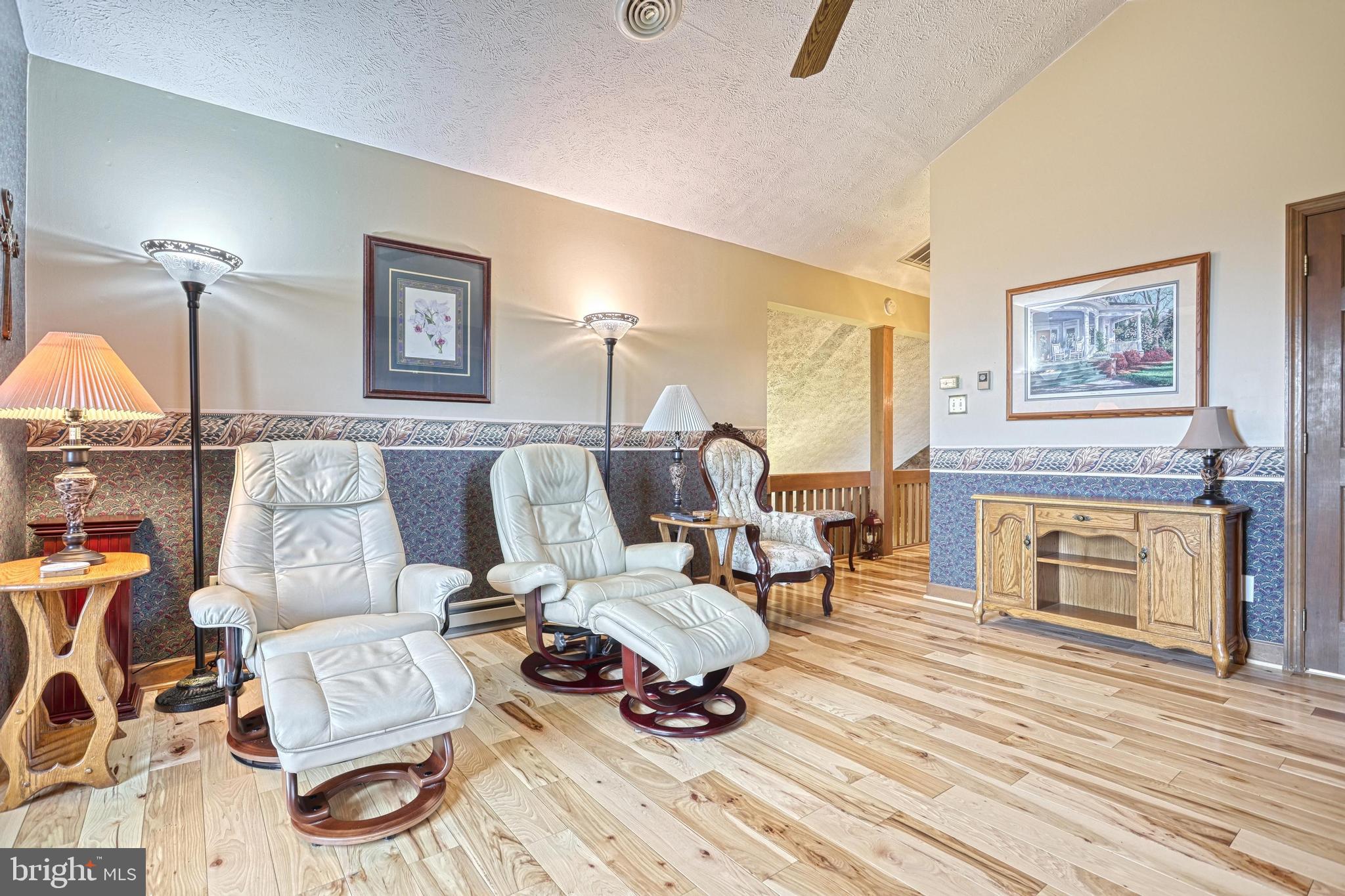 3035 Stillhouse Hollow Road Shippensburg, PA 17257 - Photo 111 of 129 a living room with furniture and a fireplace