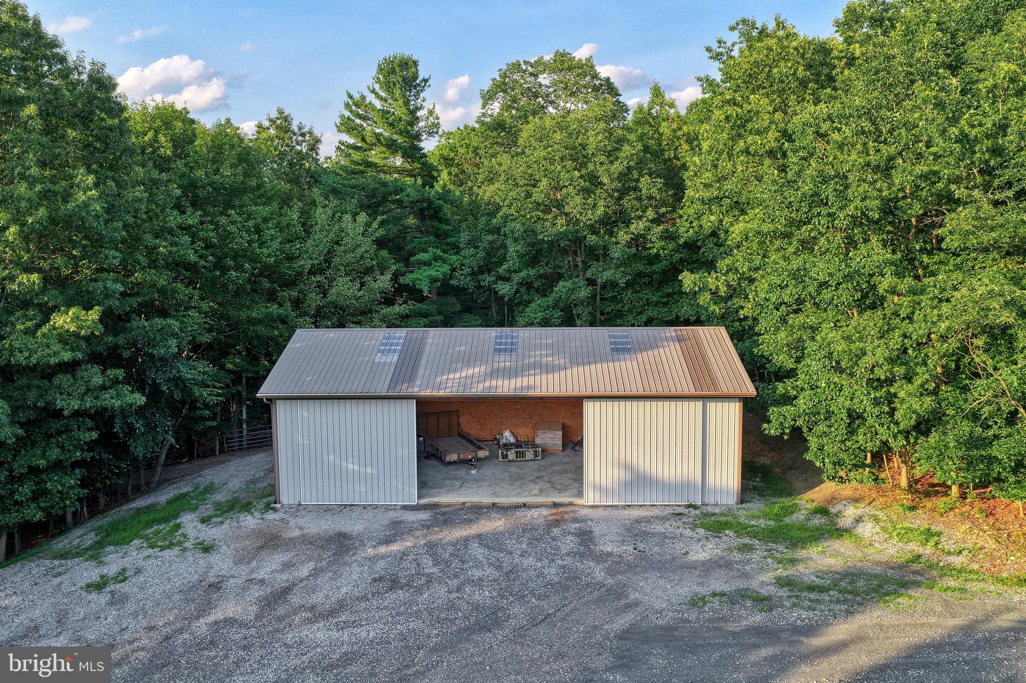 3035 Stillhouse Hollow Road Shippensburg, PA 17257 - Photo 23 of 129 a backyard of a house with table and chairs