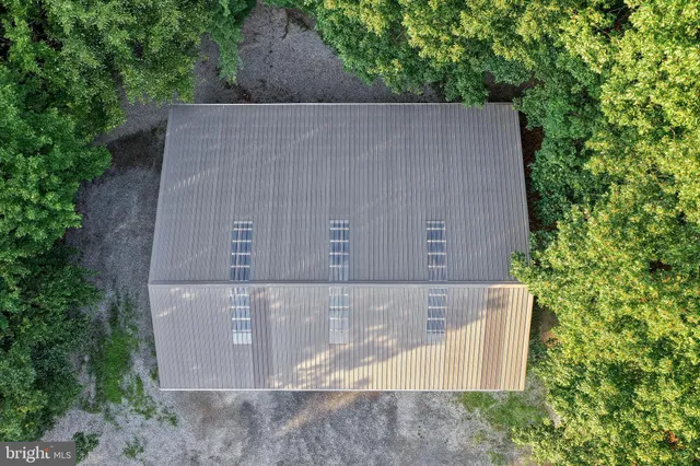 a view of a backyard with potted plants