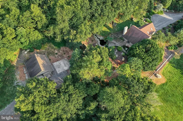 a view of house with backyard and garden