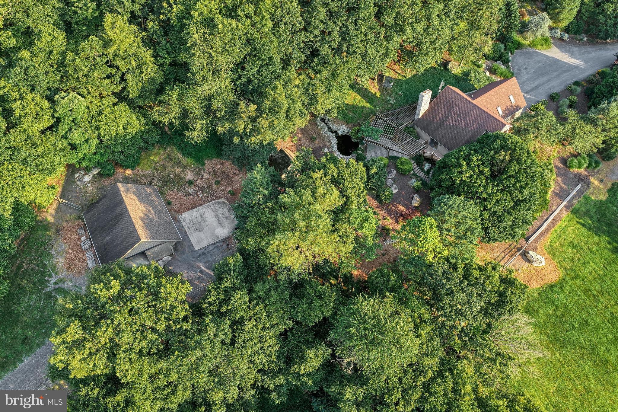 3035 Stillhouse Hollow Road Shippensburg, PA 17257 - Photo 30 of 129 an aerial view of a house with a yard and outdoor seating