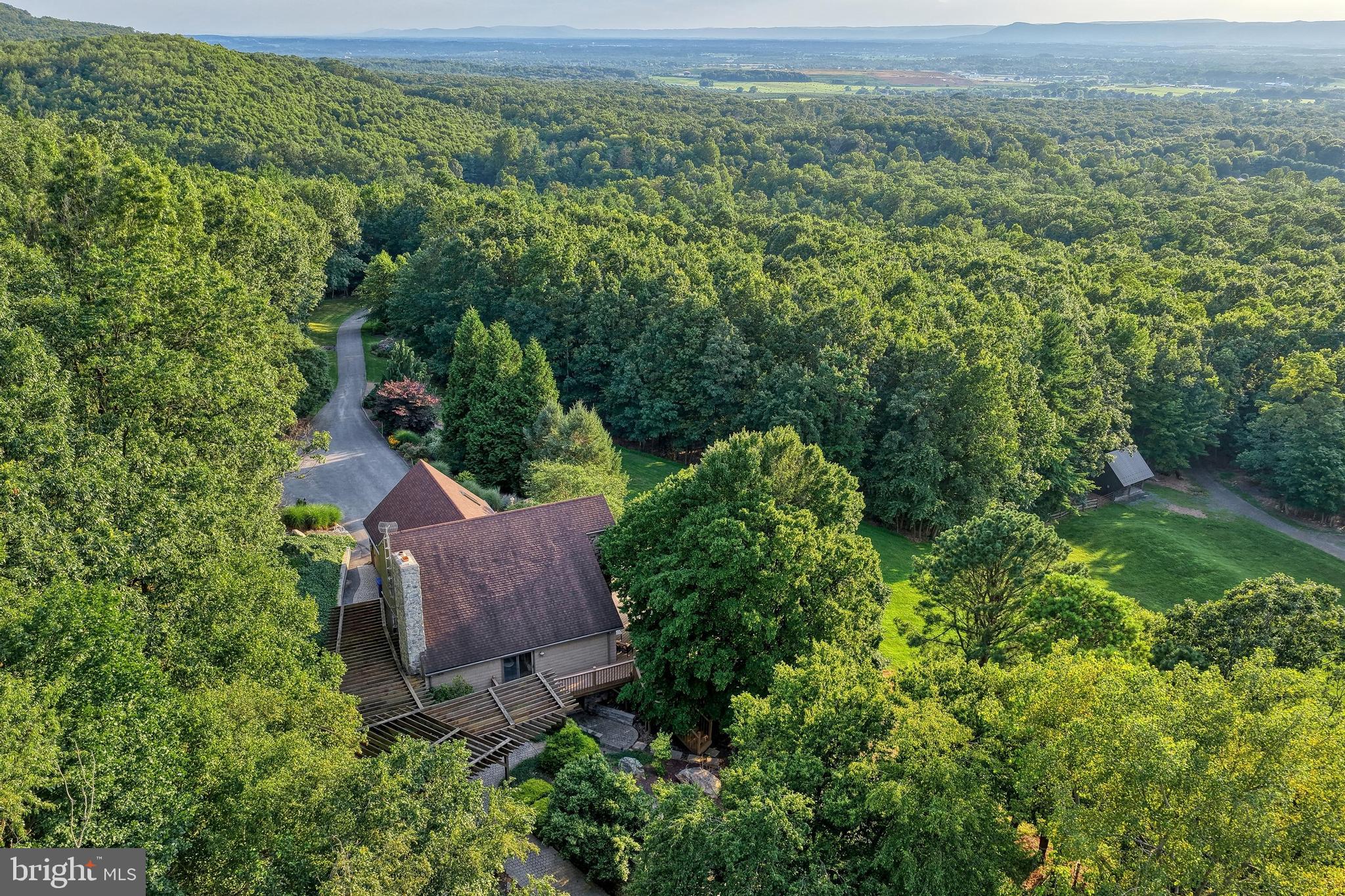 3035 Stillhouse Hollow Road Shippensburg, PA 17257 - Photo 31 of 129 an aerial view of a house with a yard and outdoor seating