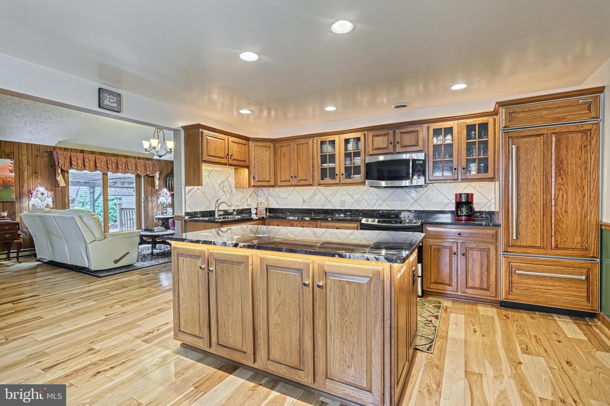3035 Stillhouse Hollow Road Shippensburg, PA 17257 - Photo 84 of 129 a kitchen with stainless steel appliances granite countertop a stove and a sink