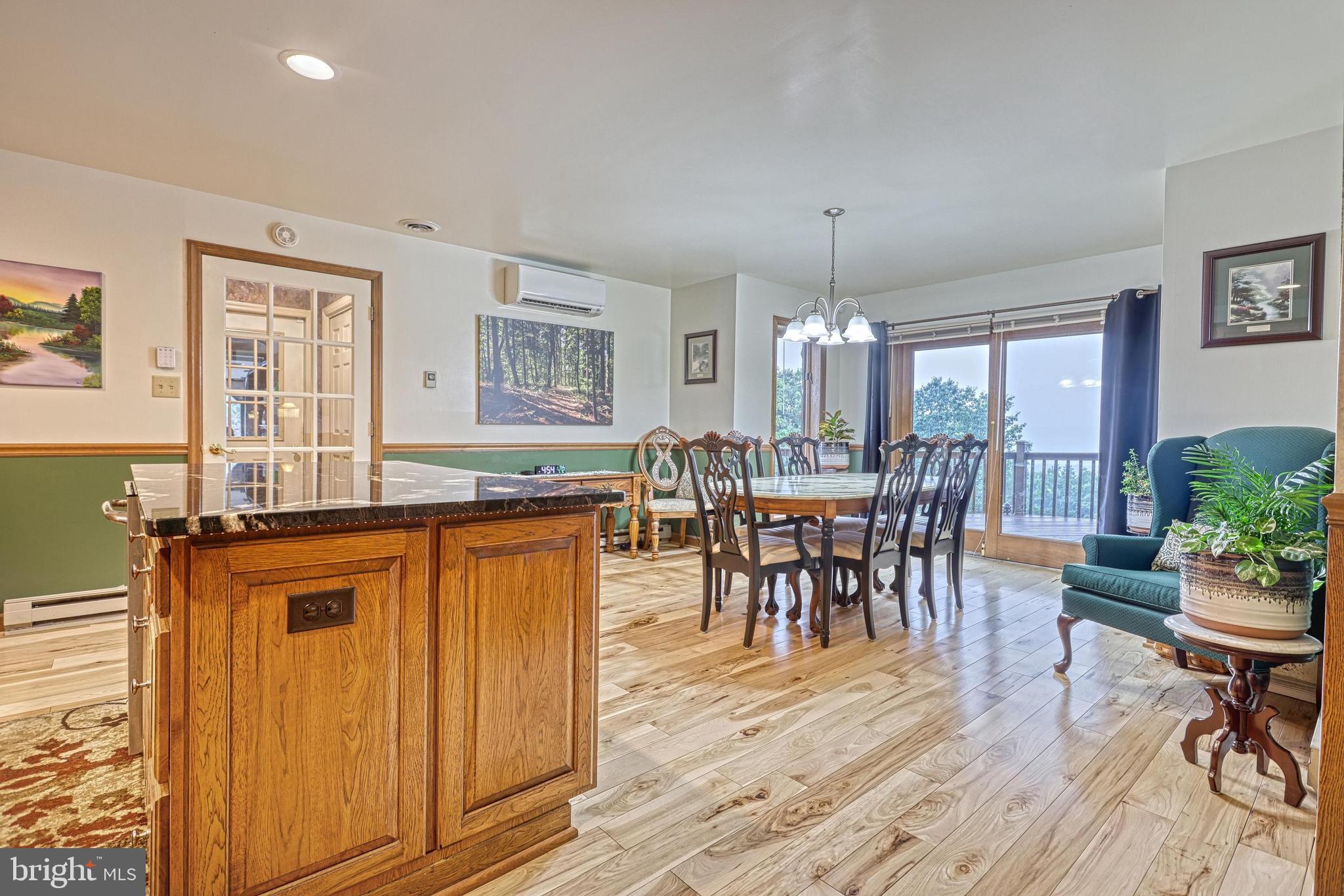 3035 Stillhouse Hollow Road Shippensburg, PA 17257 - Photo 91 of 129 a view of a dining room with furniture window and wooden floor