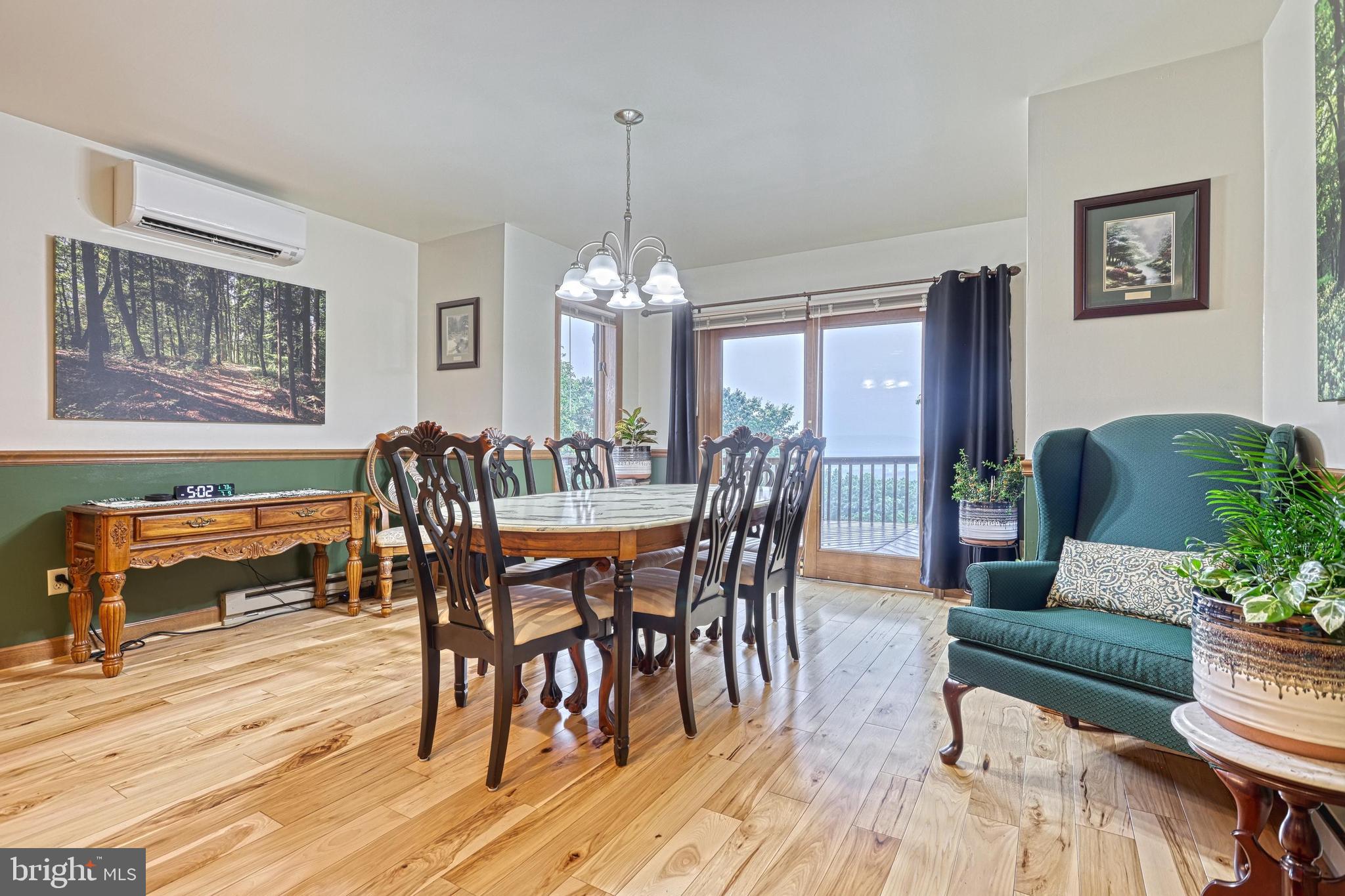 3035 Stillhouse Hollow Road Shippensburg, PA 17257 - Photo 93 of 129 a view of a dining room with furniture window and wooden floor
