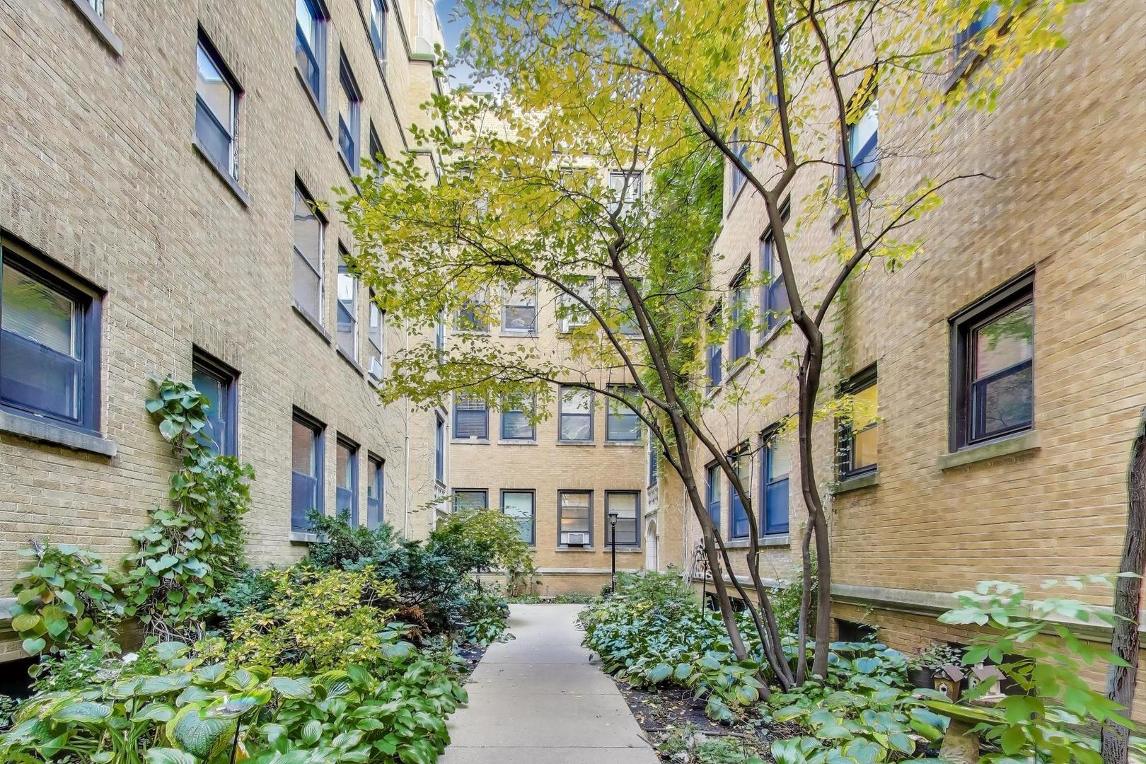 636 West Waveland Avenue, Unit 2E Chicago, IL 60613 - Photo 5 of 23 a view of a pathway with a house in the background