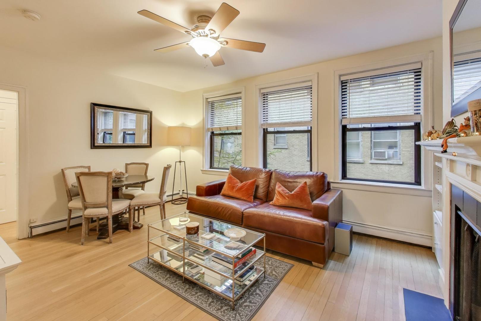 636 West Waveland Avenue, Unit 2E Chicago, IL 60613 - Photo 7 of 23 a living room with furniture and a window