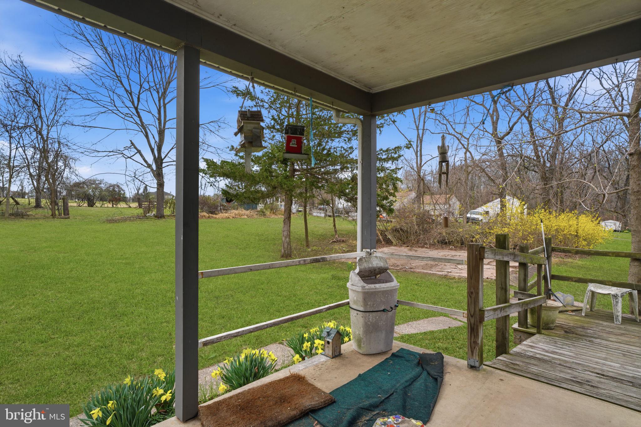34 Aqueduct Road Washington Crossing, PA 18977 - Photo 17 of 38 a view of a porch and garden