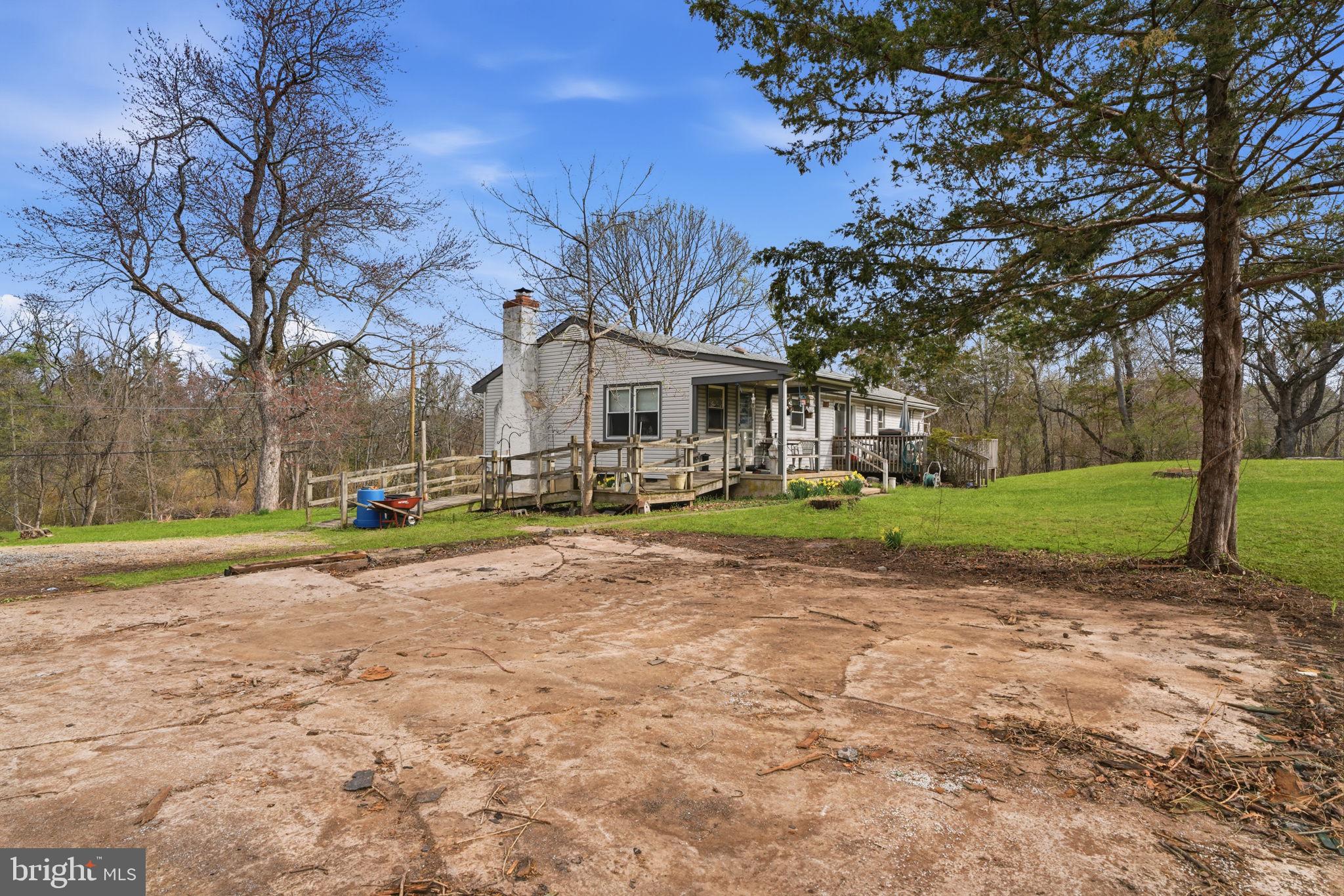 34 Aqueduct Road Washington Crossing, PA 18977 - Photo 20 of 38 a view of a house with garden and tall trees