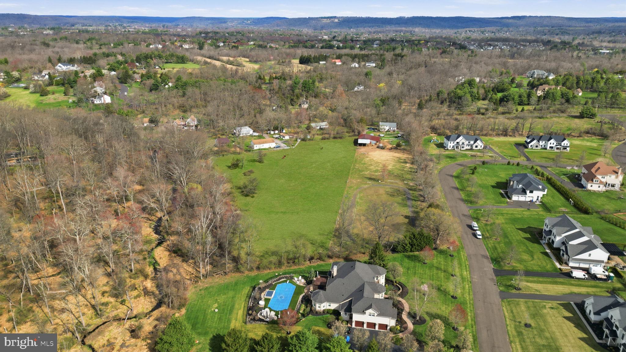 34 Aqueduct Road Washington Crossing, PA 18977 - Photo 3 of 38 an aerial view of lake houses with outdoor space