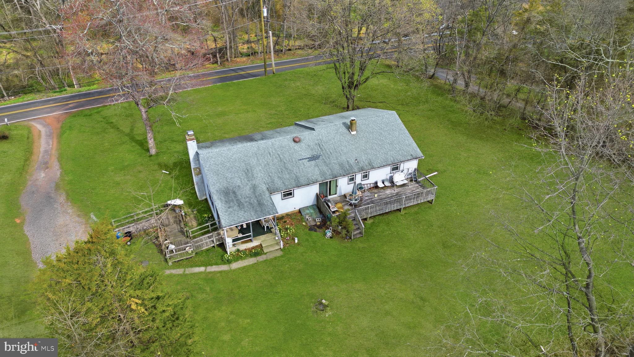 34 Aqueduct Road Washington Crossing, PA 18977 - Photo 9 of 38 an aerial view of a house with a yard