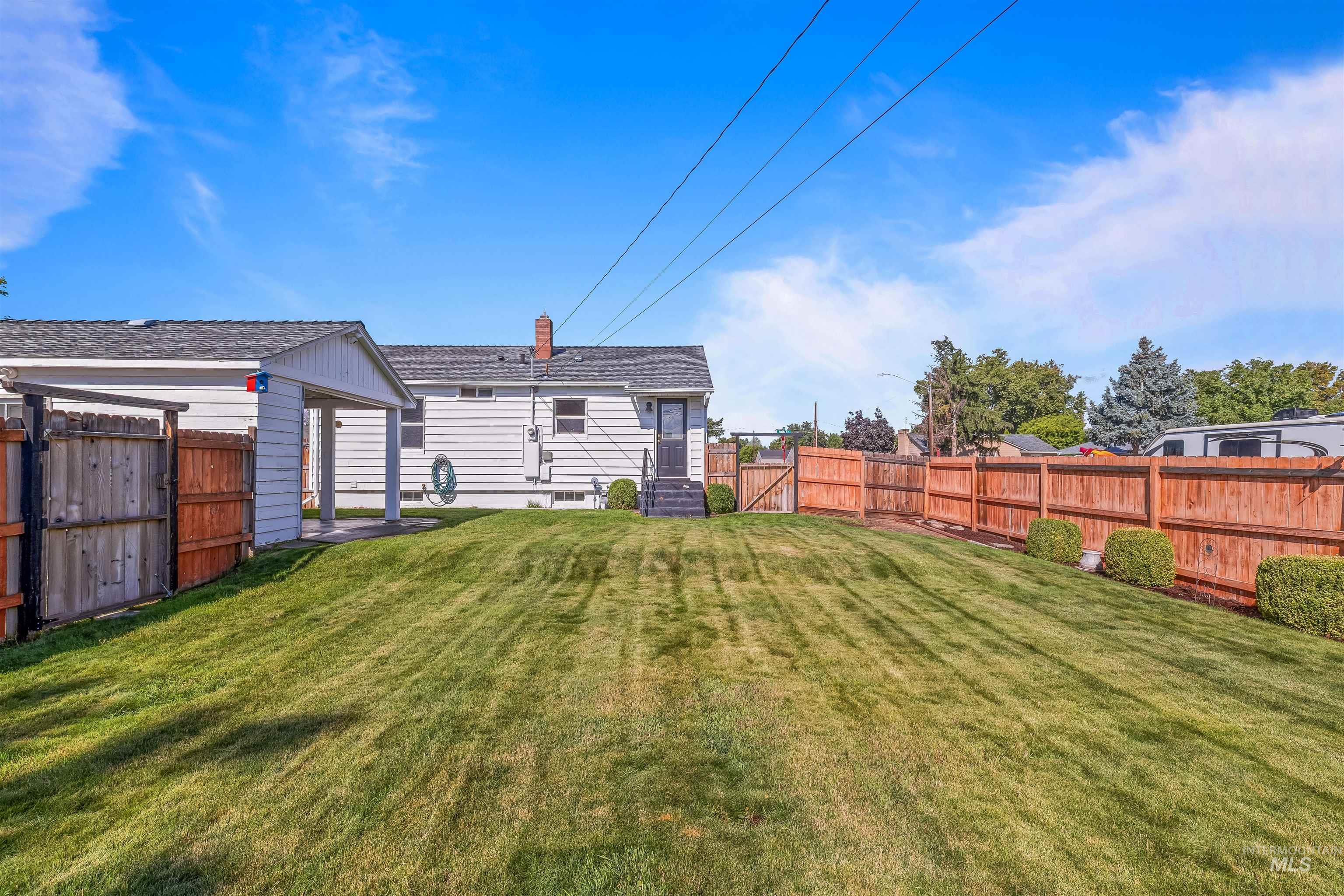 1303 4th Street Clarkston, WA 99403 - Photo 17 of 32 Rear view of property with a fenced backyard