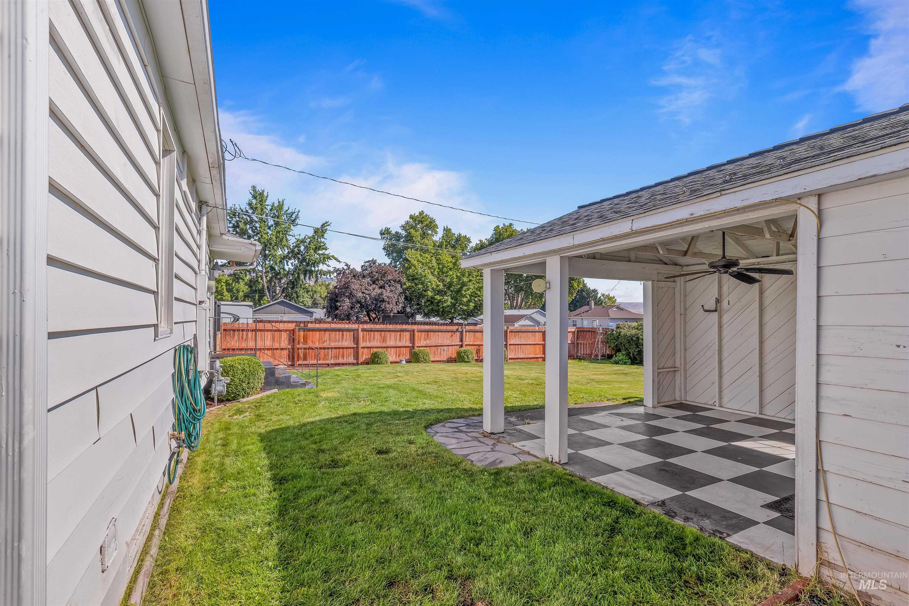1303 4th Street Clarkston, WA 99403 - Photo 18 of 32 Fenced backyard featuring ceiling fan