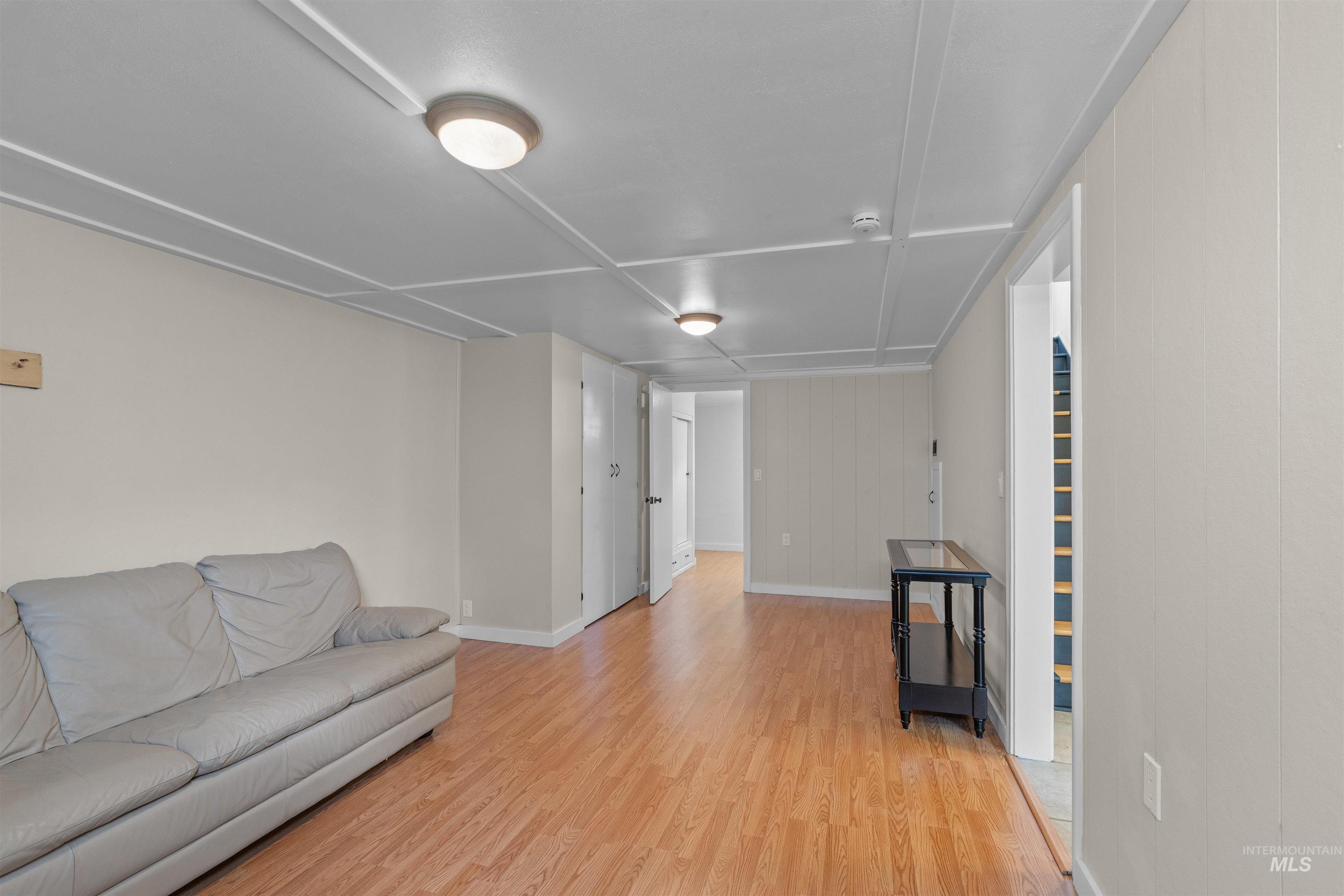 1303 4th Street Clarkston, WA 99403 - Photo 22 of 32 Living room featuring light wood-type flooring and baseboards