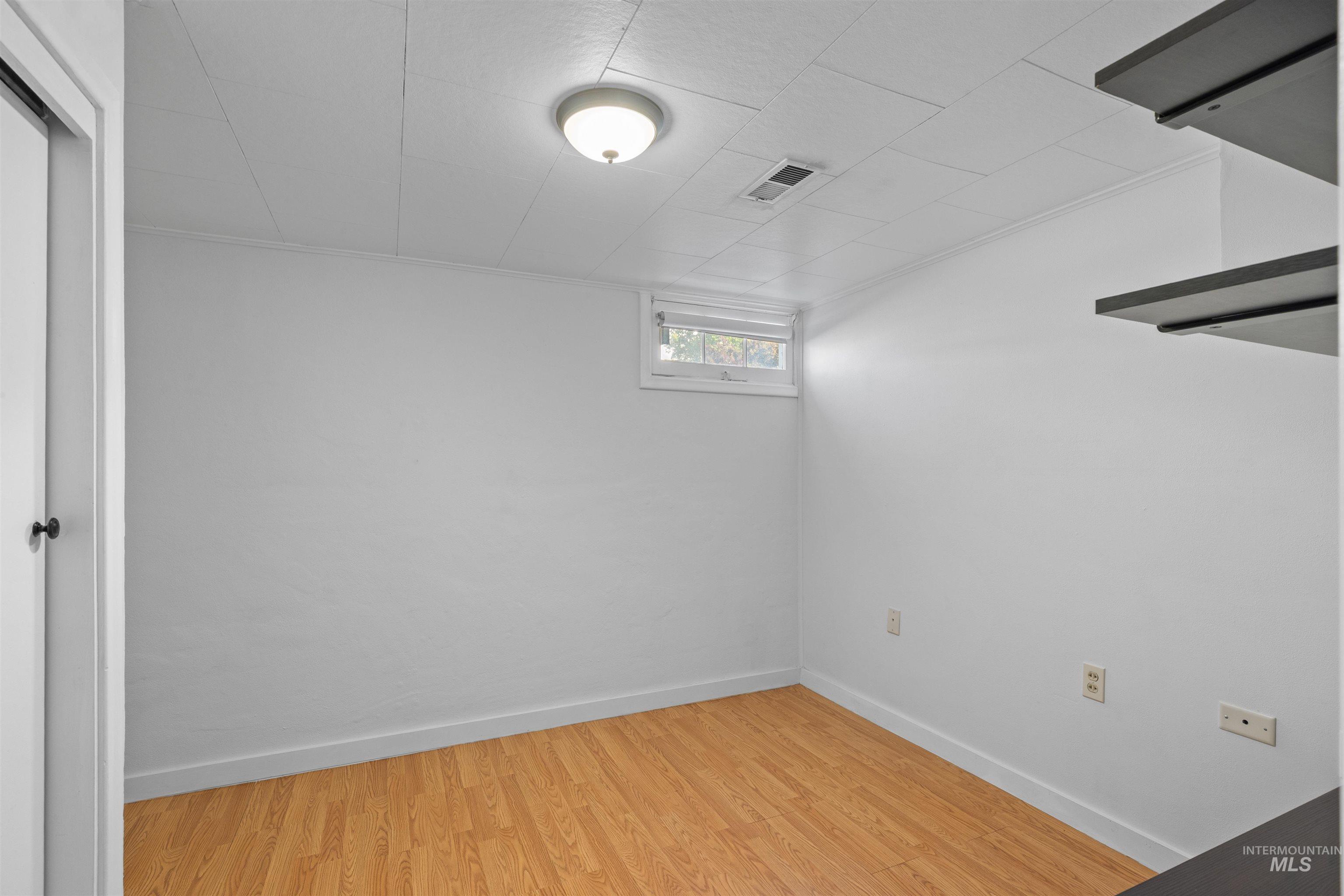 1303 4th Street Clarkston, WA 99403 - Photo 23 of 32 Below grade area featuring light wood-style floors and baseboards