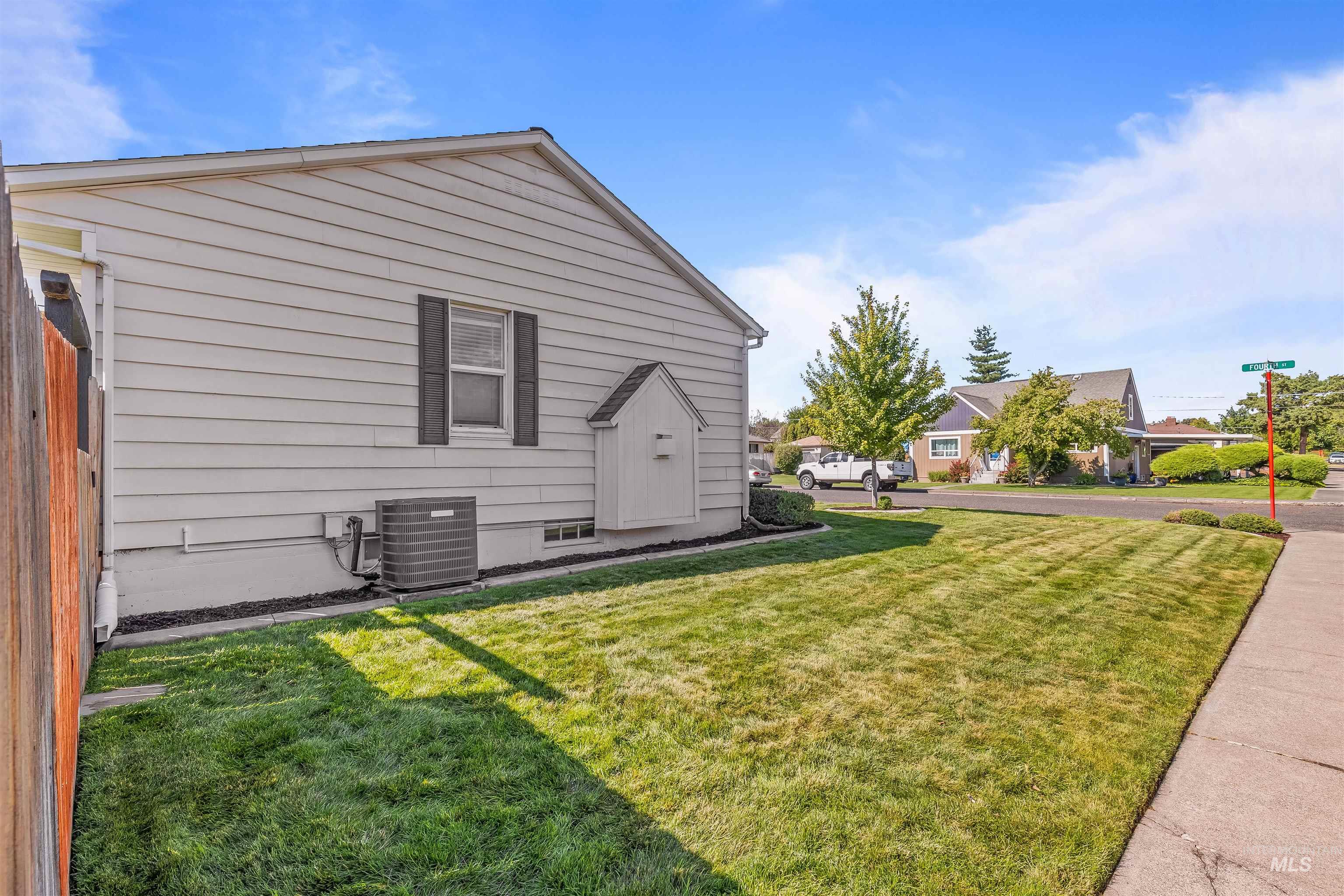 1303 4th Street Clarkston, WA 99403 - Photo 28 of 32 View of home's exterior featuring a lawn
