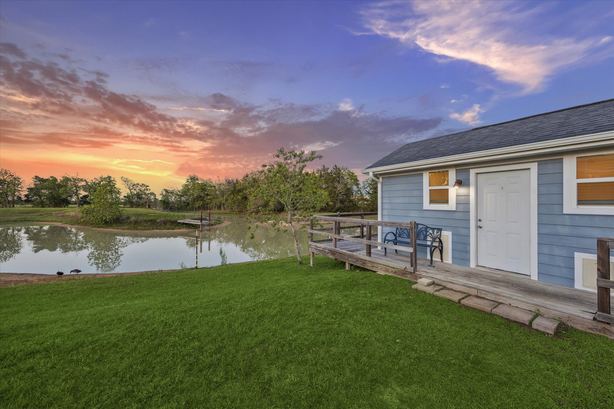 10347 Pless Road Cat Spring, TX 78933 - Photo 25 of 41 a backyard of a house with table and chairs