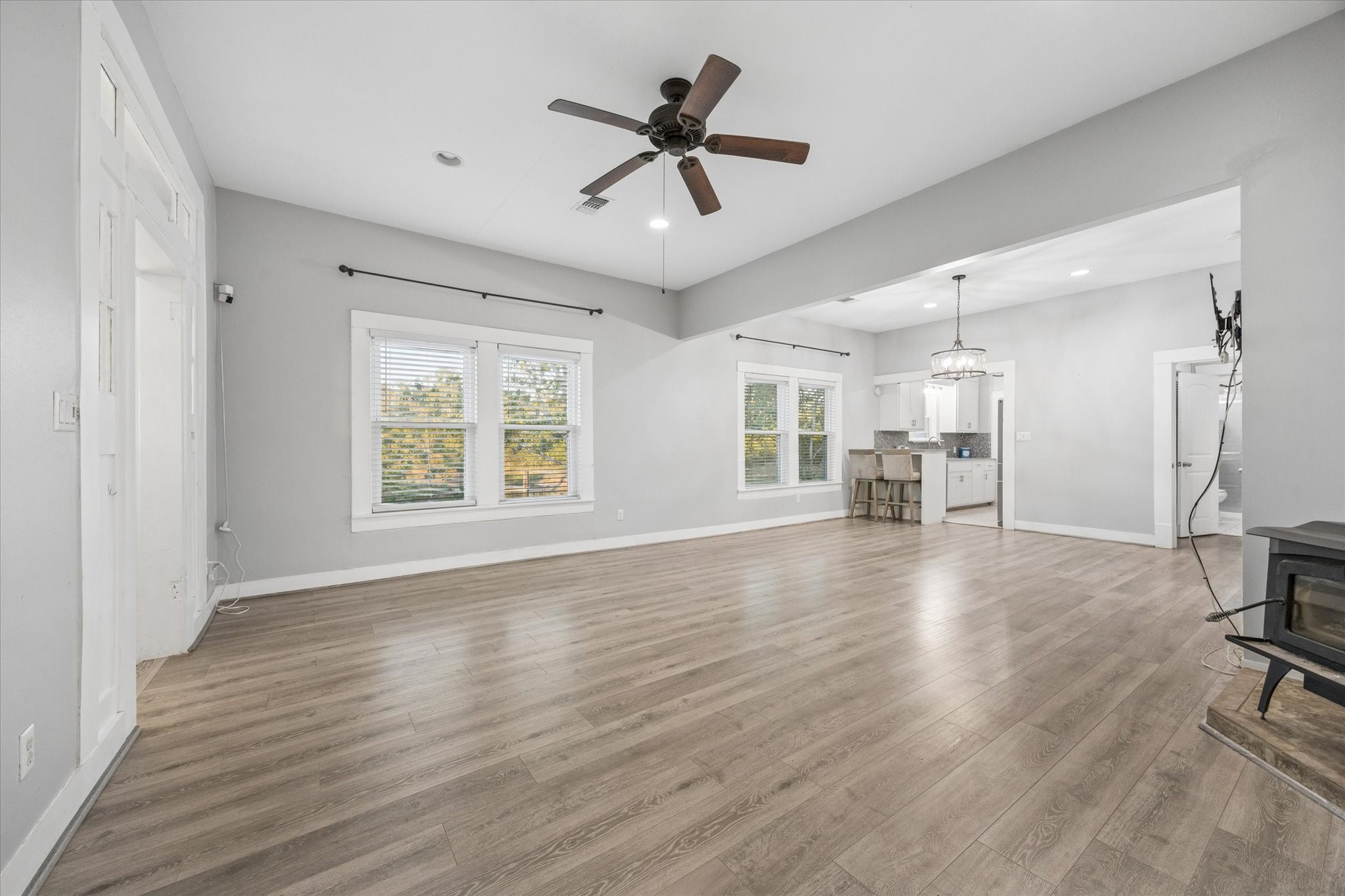 10347 Pless Road Cat Spring, TX 78933 - Photo 9 of 41 wooden floor in an empty room with a window