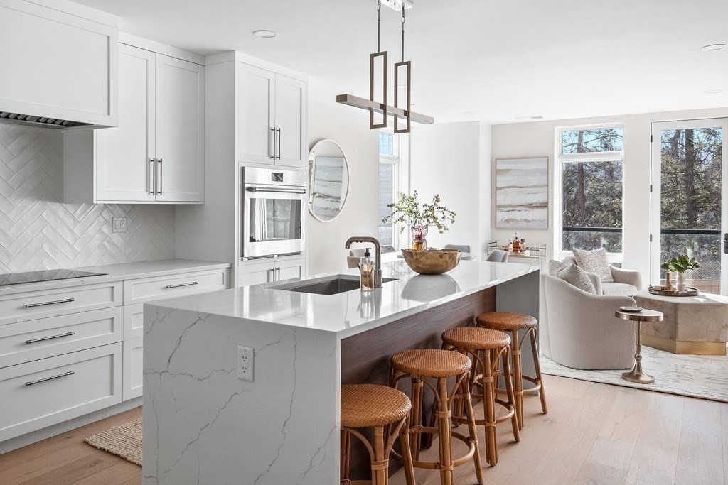 20 Kinmonth Road, Unit 206 Newton, MA 02468 - Photo 1 of 25 a kitchen with large counter top space appliances and cabinets