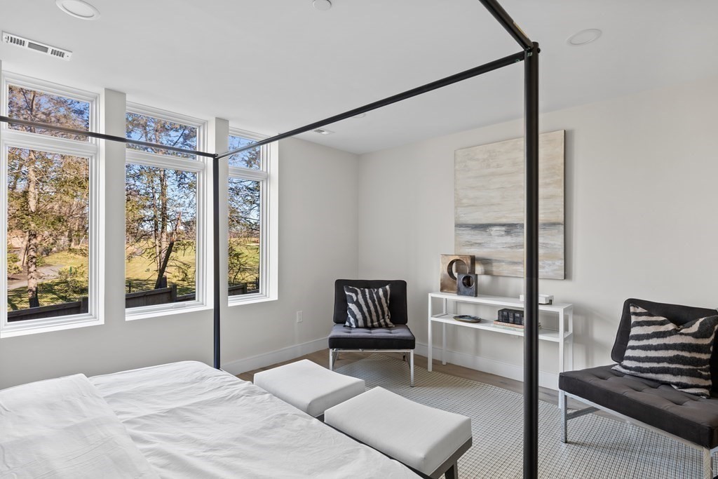 20 Kinmonth Road, Unit 206 Newton, MA 02468 - Photo 9 of 25 a bedroom with a bed and a window with the outer view