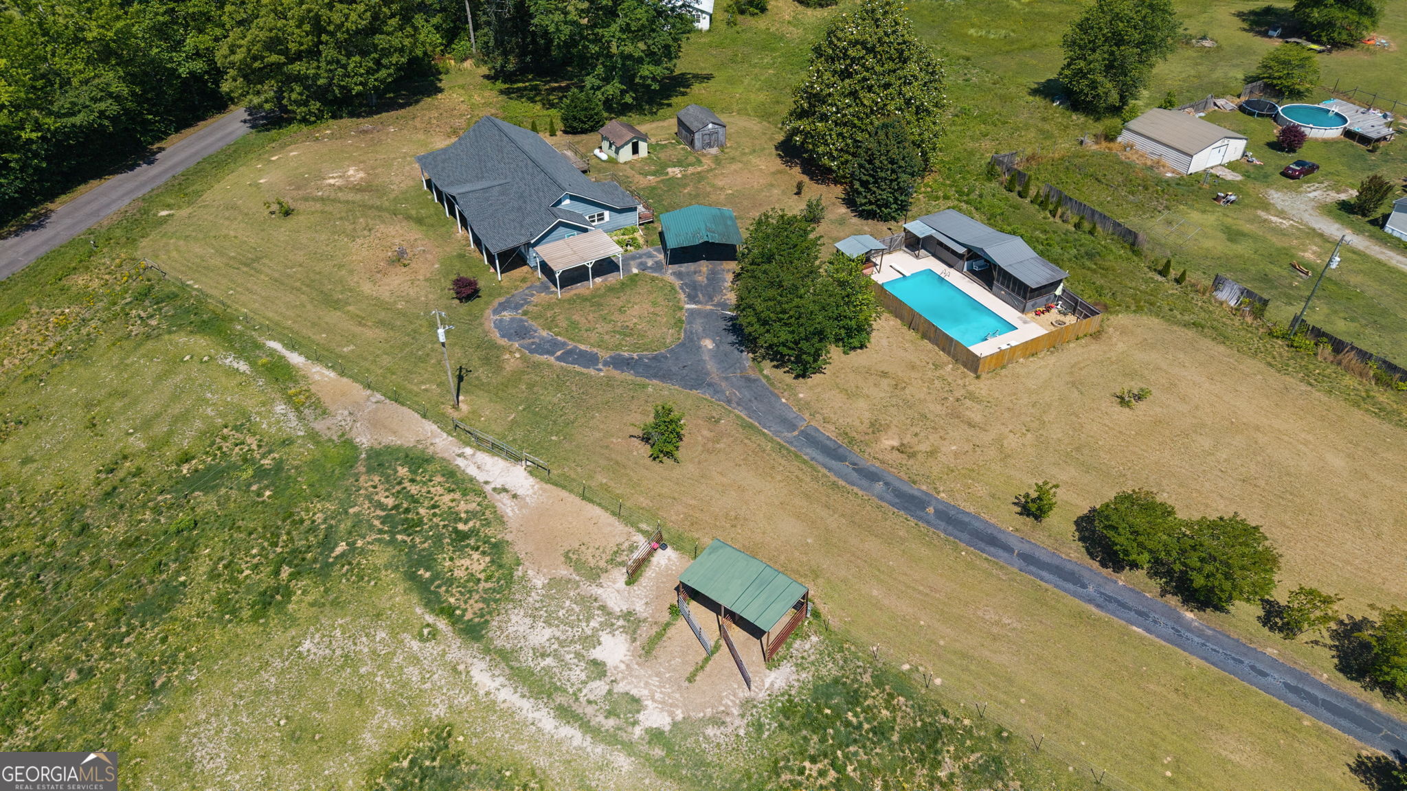 49 Frost Road Bowdon, GA 30108 - Photo 55 of 60 an aerial view of a house with a yard and lake view