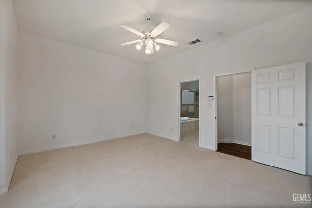 a kitchen that has a lot of cabinets in it