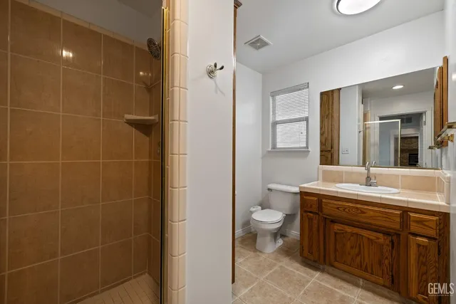 a view of a house with a big yard and sitting area