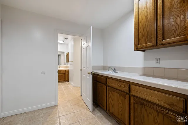 a view of a backyard with sitting area