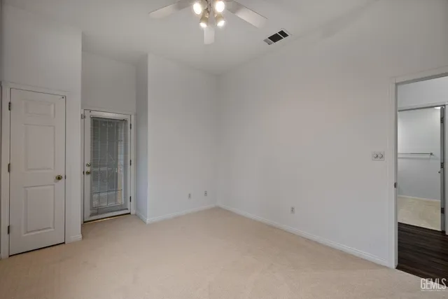 an aerial view of a house with a garden and lake view