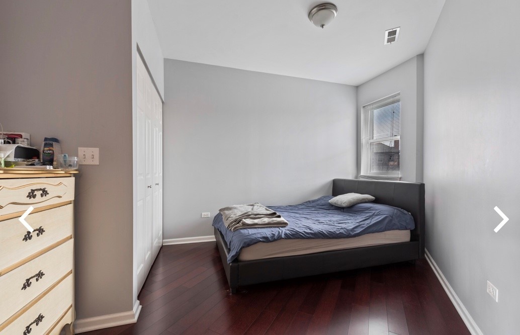 1407 South Halsted Street, Unit 2B Chicago, IL 60607 - Photo 11 of 16 a bedroom with a bed and a dresser