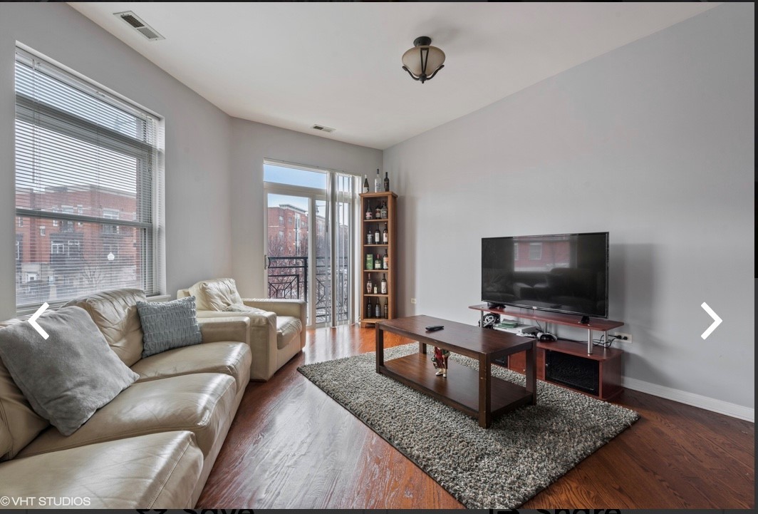 1407 South Halsted Street, Unit 2B Chicago, IL 60607 - Photo 3 of 16 a living room with furniture and a flat screen tv