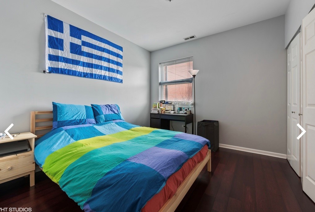 1407 South Halsted Street, Unit 2B Chicago, IL 60607 - Photo 10 of 16 a bedroom with a bed and a window