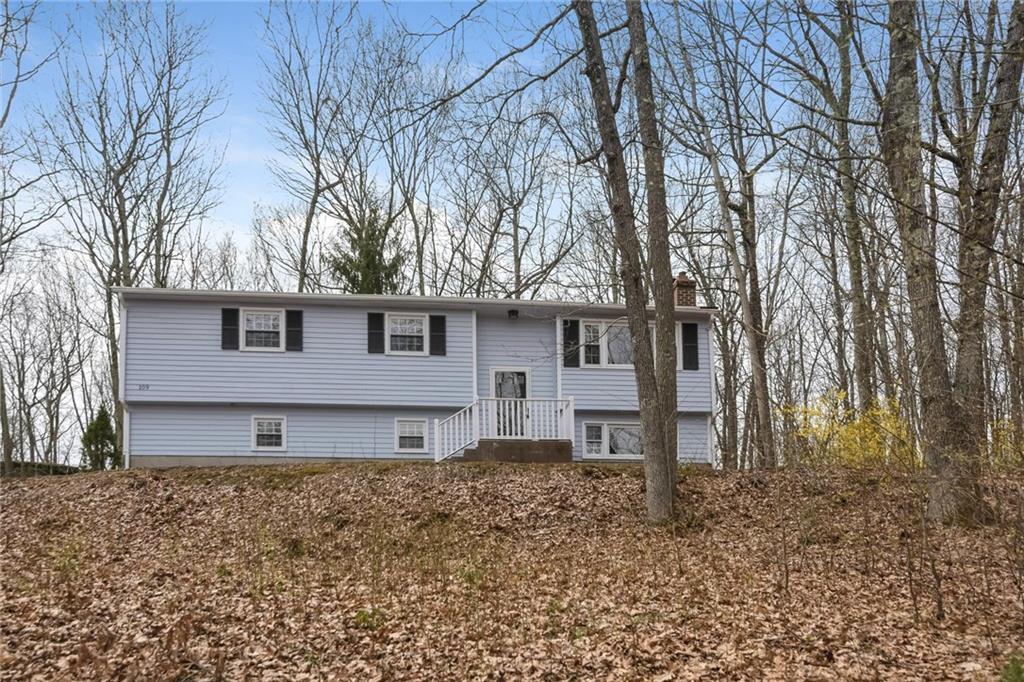 109 Dickinson Road Marlborough, CT 06447 - Photo 1 of 1 a front view of a house with garden