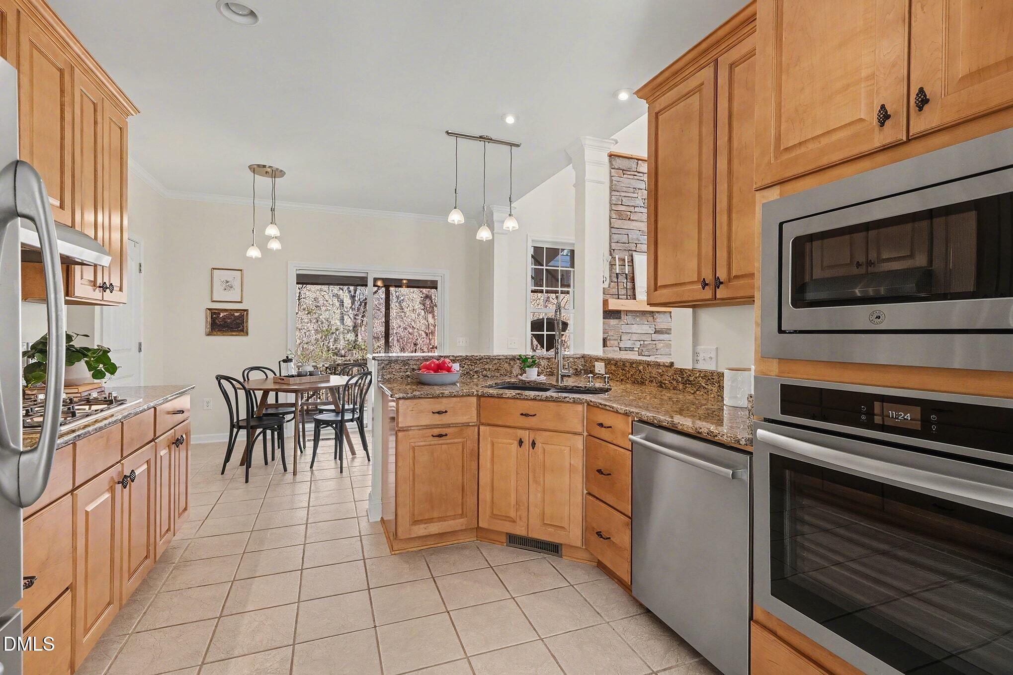29 Chestnut Bluffs Lane Durham, NC 27713 - Photo 11 of 45 a kitchen with appliances cabinets and furniture