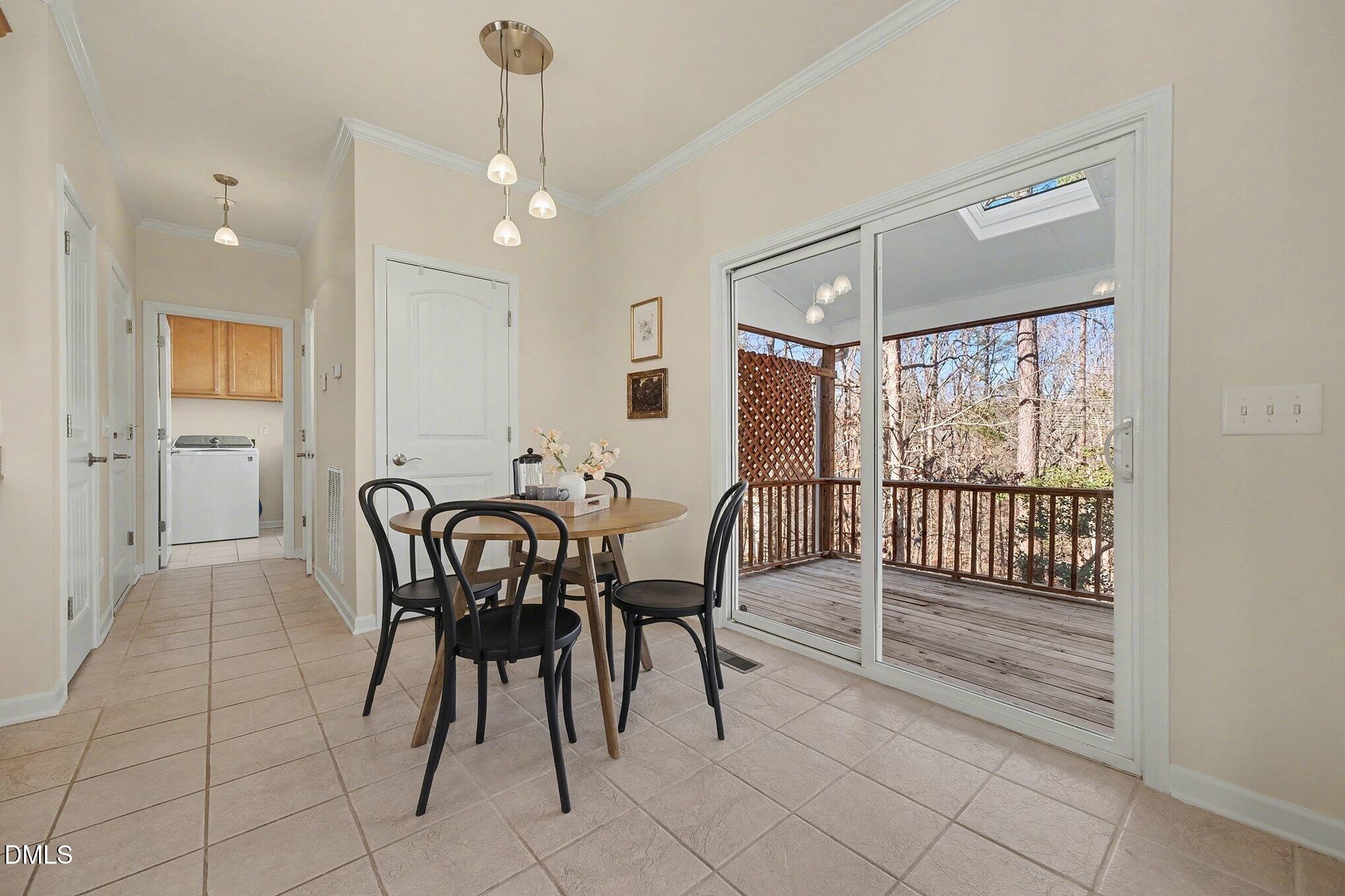 29 Chestnut Bluffs Lane Durham, NC 27713 - Photo 12 of 45 a view of a a dining room with furniture window and outside view