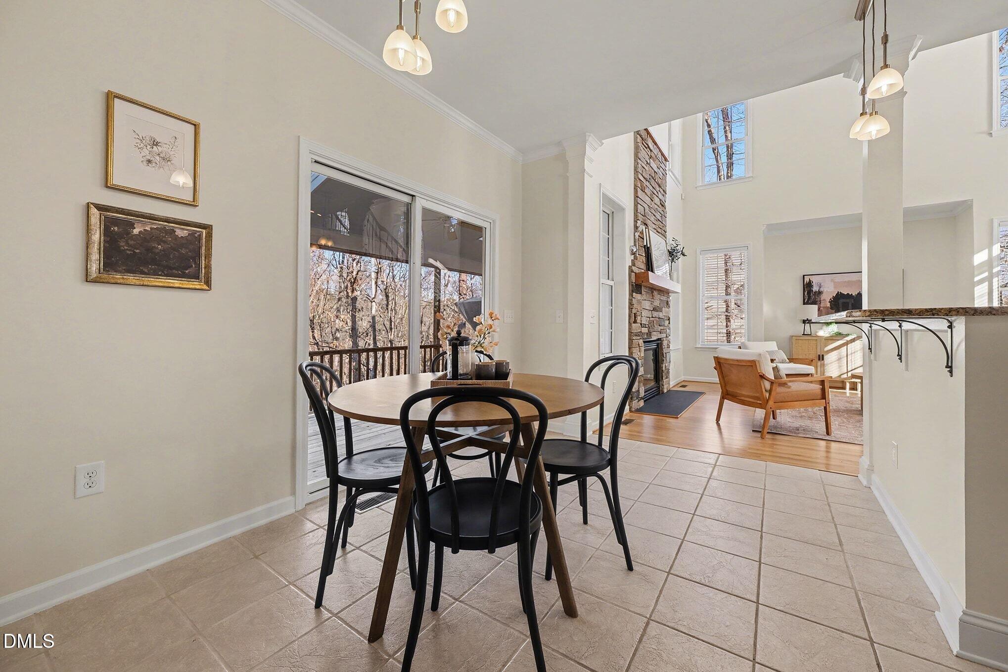 29 Chestnut Bluffs Lane Durham, NC 27713 - Photo 13 of 45 a view of a dining room with furniture and a potted plant