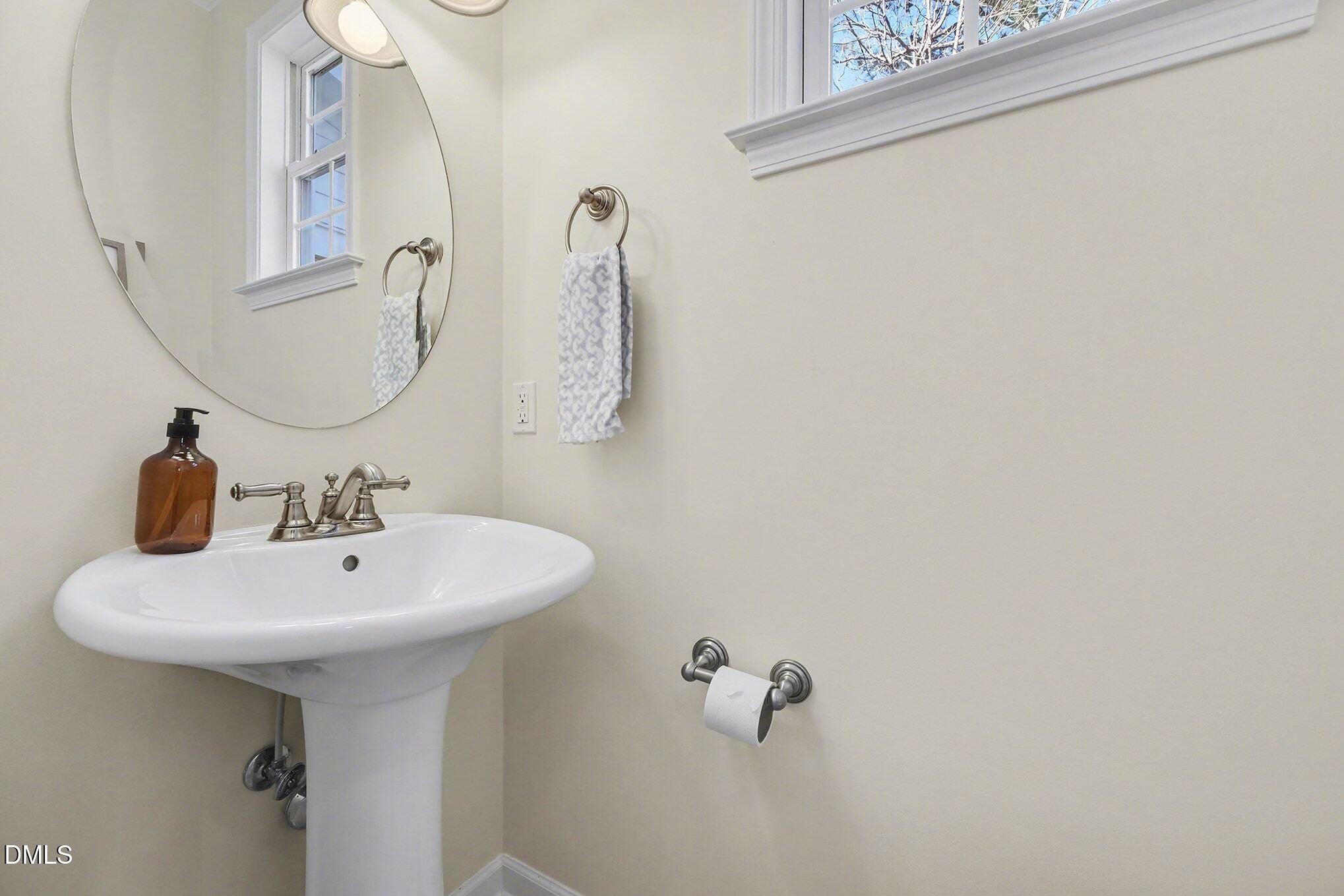 29 Chestnut Bluffs Lane Durham, NC 27713 - Photo 14 of 45 a bathroom with a sink and mirror