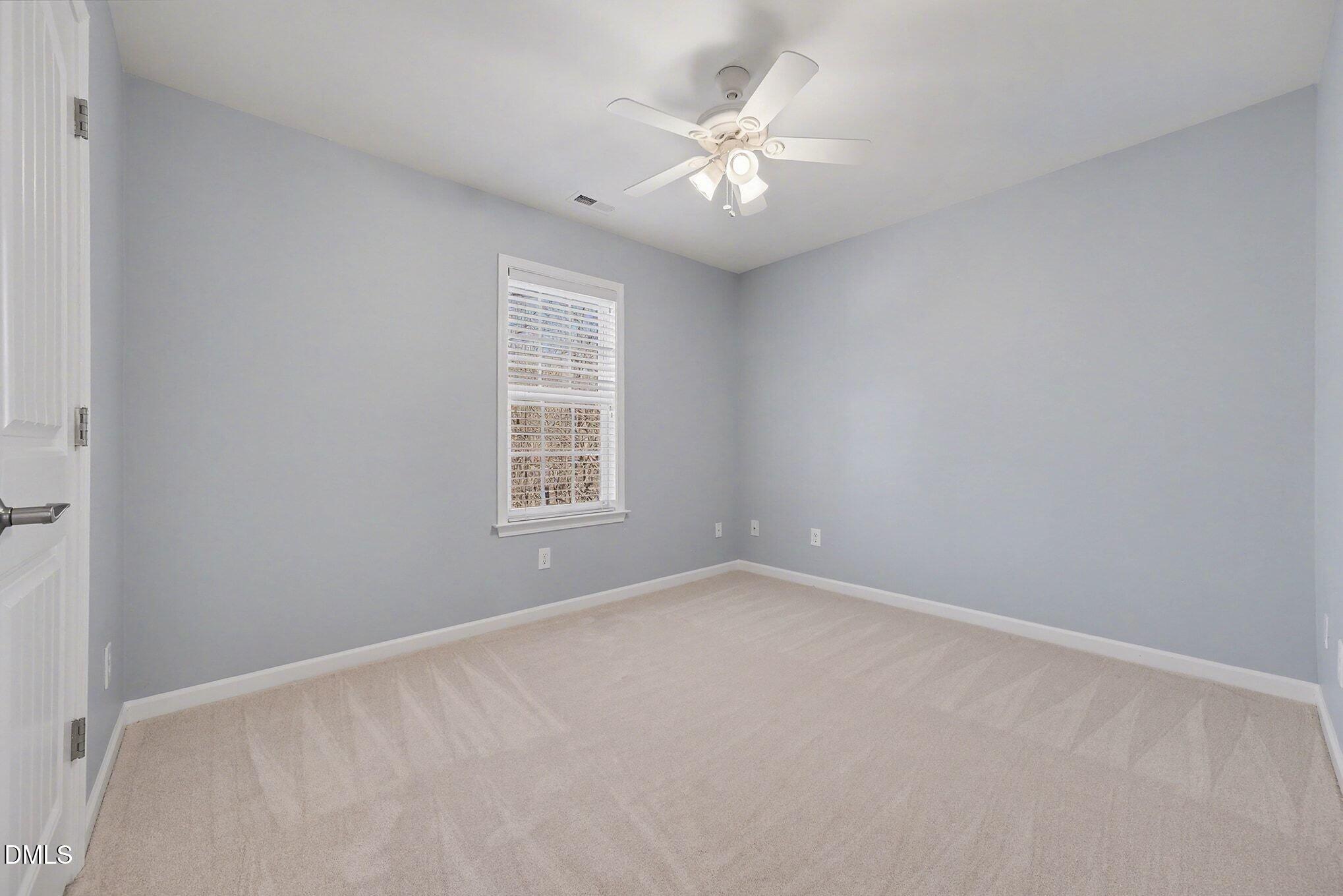 29 Chestnut Bluffs Lane Durham, NC 27713 - Photo 20 of 45 an empty room with windows