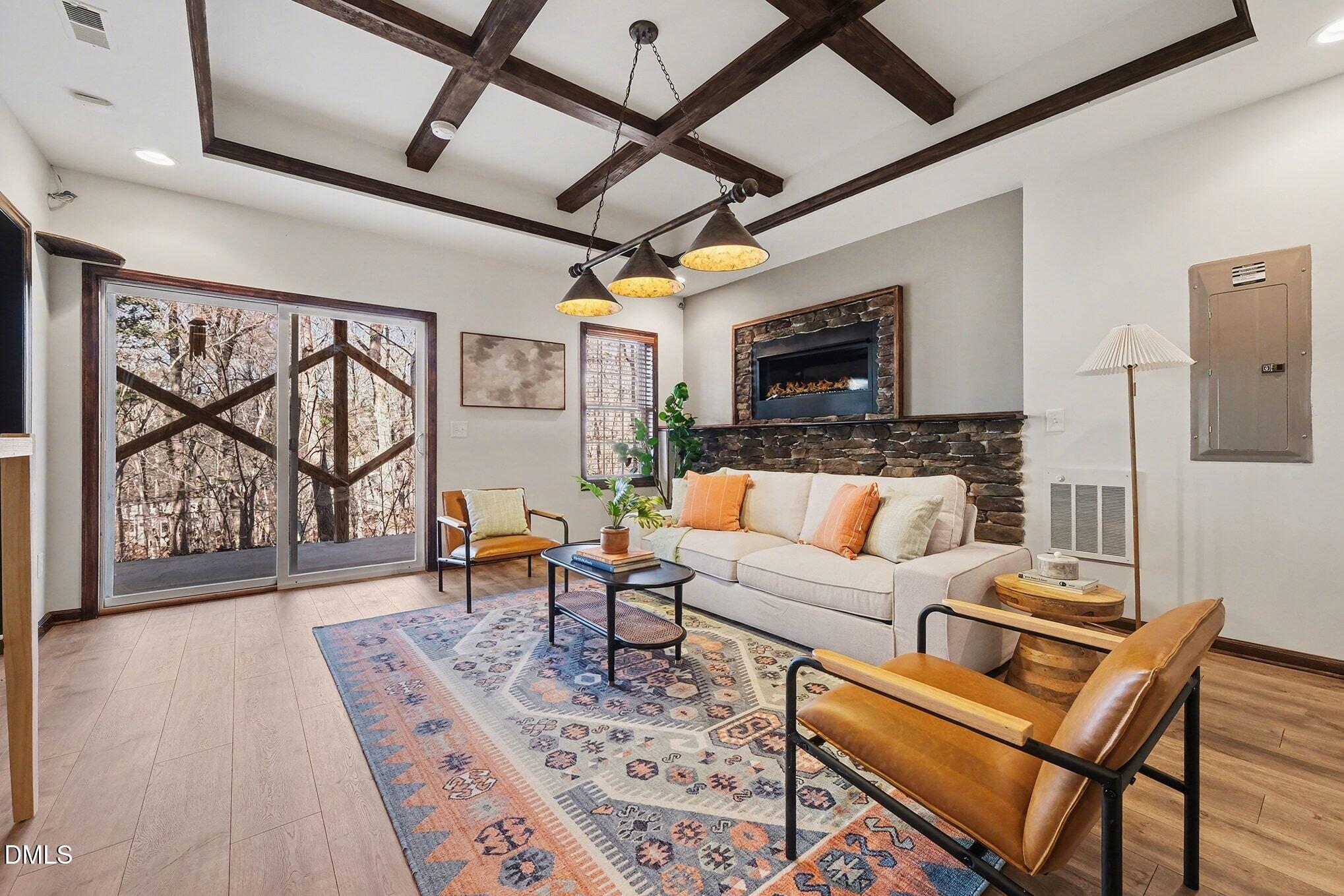 29 Chestnut Bluffs Lane Durham, NC 27713 - Photo 25 of 45 a living room with furniture and a flat screen tv
