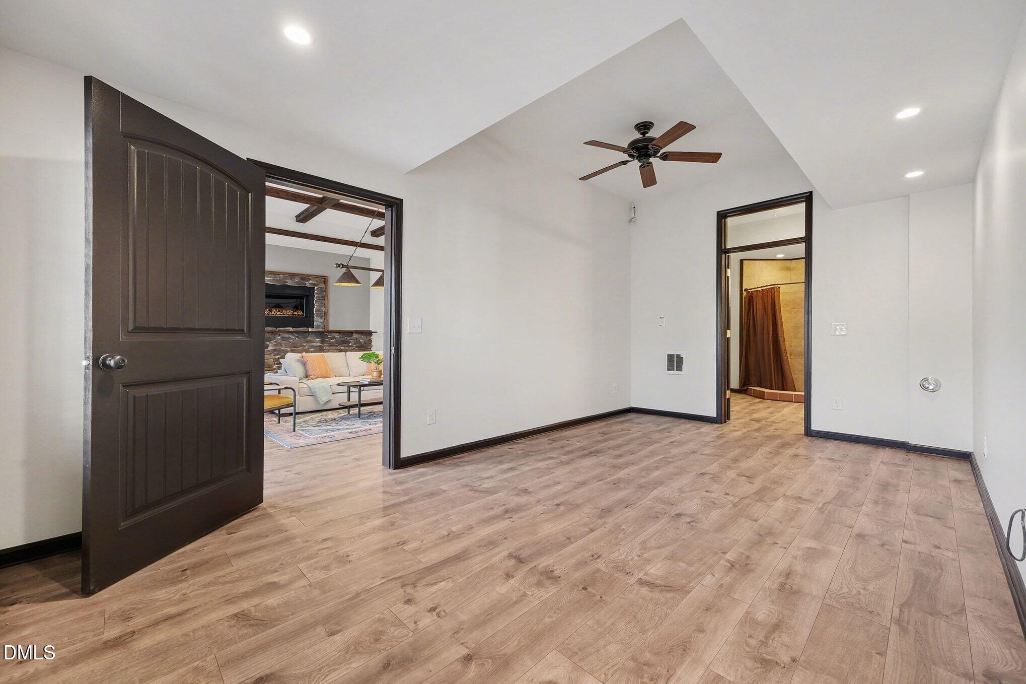 29 Chestnut Bluffs Lane Durham, NC 27713 - Photo 27 of 45 a view of a hallway with a chandelier