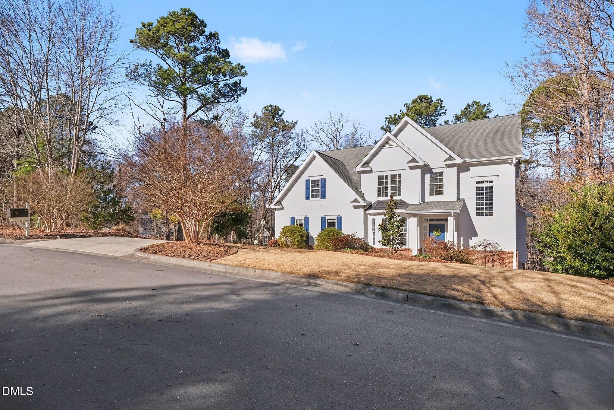 29 Chestnut Bluffs Lane Durham, NC 27713 - Photo 36 of 45 a front view of a house with a yard and garage