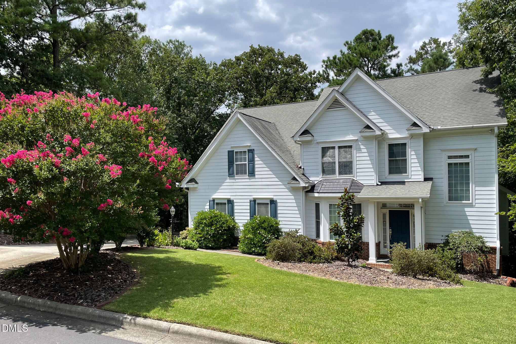 29 Chestnut Bluffs Lane Durham, NC 27713 - Photo 39 of 45 a front view of a house with a yard and potted plants