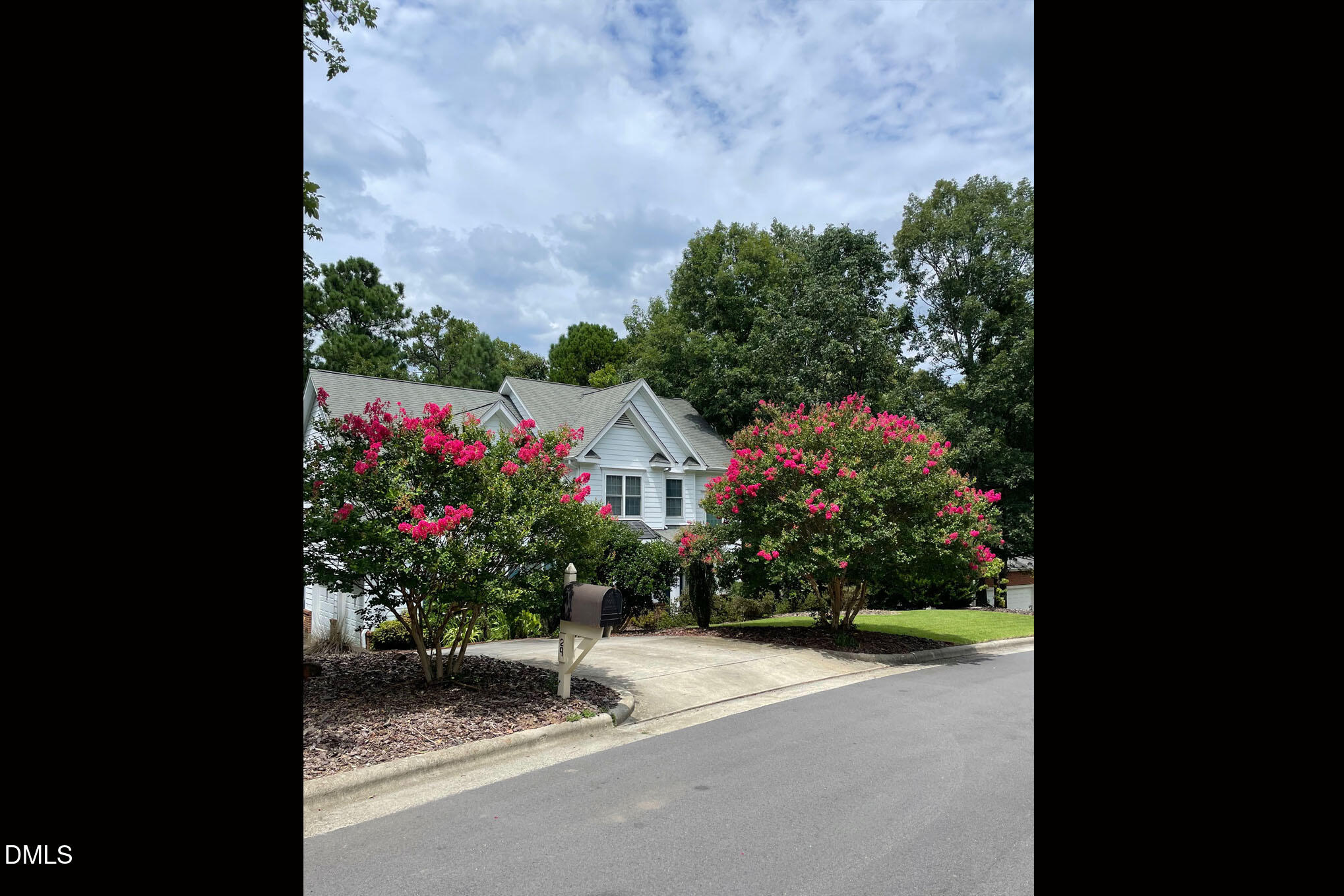 29 Chestnut Bluffs Lane Durham, NC 27713 - Photo 40 of 45 a front view of a house with a yard and a garage