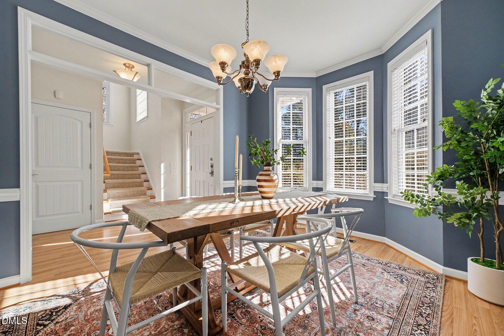 29 Chestnut Bluffs Lane Durham, NC 27713 - Photo 8 of 45 a dining room filled with furniture and wooden floor