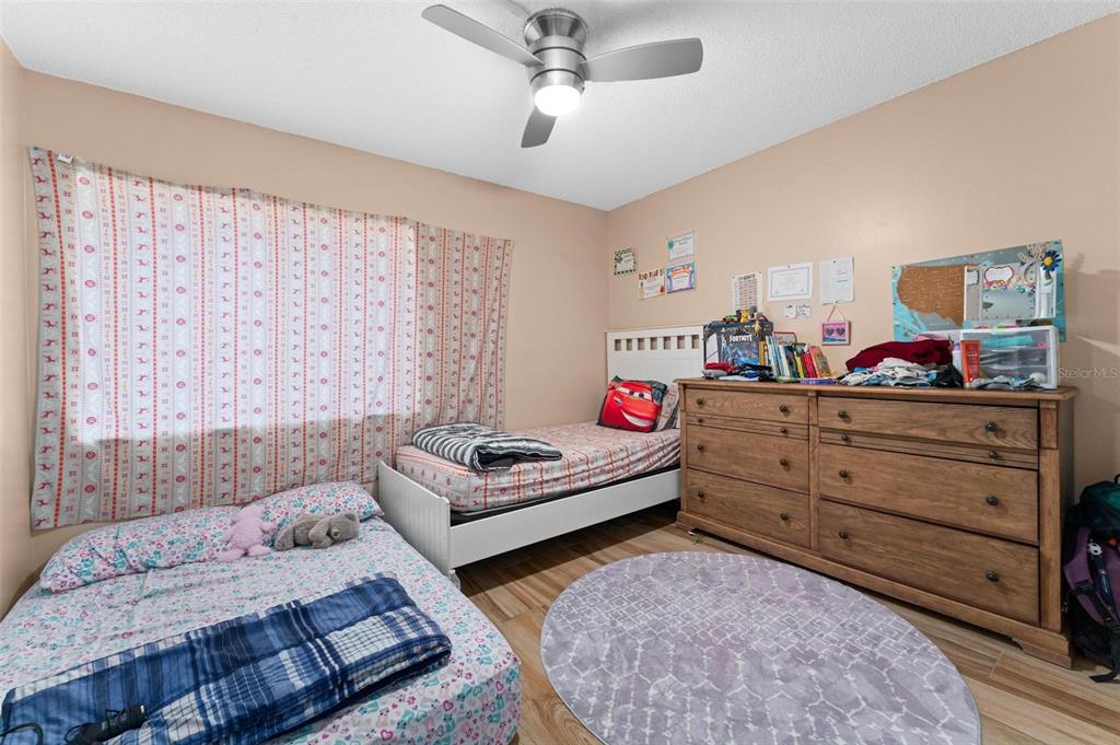 5201 Vineland Road, Unit 112 Orlando, FL 32811 - Photo 12 of 25 a bedroom with furniture and a window