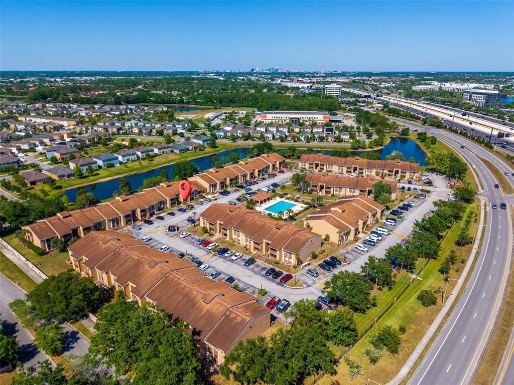 5201 Vineland Road, Unit 112 Orlando, FL 32811 - Photo 24 of 25 an aerial view of residential houses with outdoor space