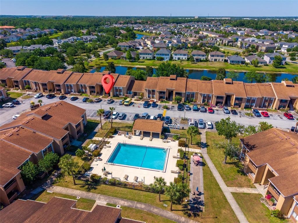 5201 Vineland Road, Unit 112 Orlando, FL 32811 - Photo 25 of 25 an aerial view of a house with a lake view
