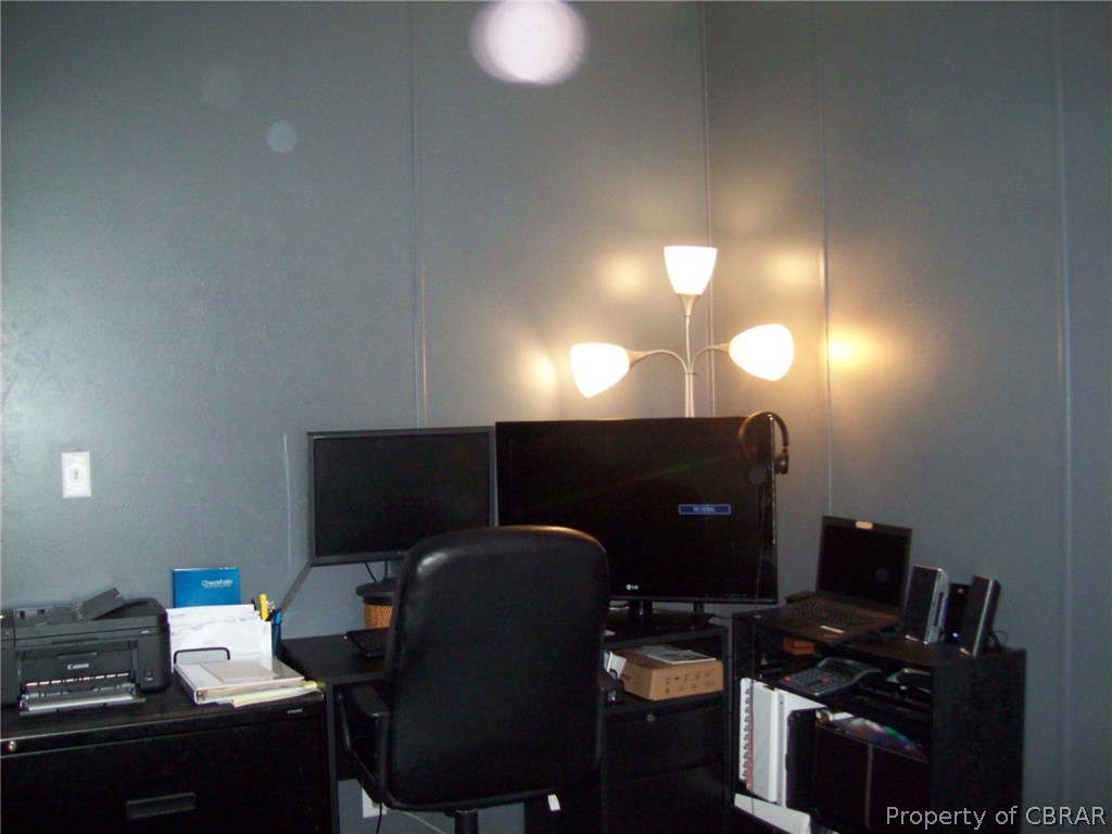133 Dixon Road Hudgins, VA 23076 - Photo 25 of 25 a workspace with furniture and lamp
